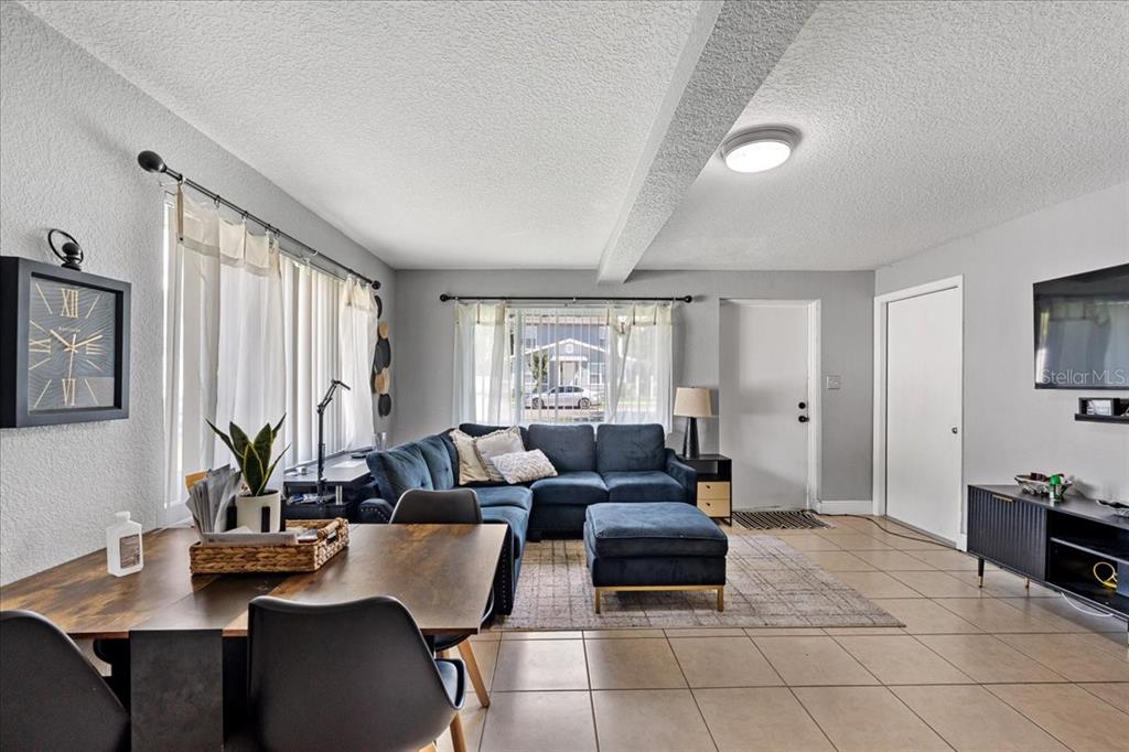 812 West Bryan Street Kissimmee, FL 34741 - Photo 6 of 27 a living room with furniture and large windows