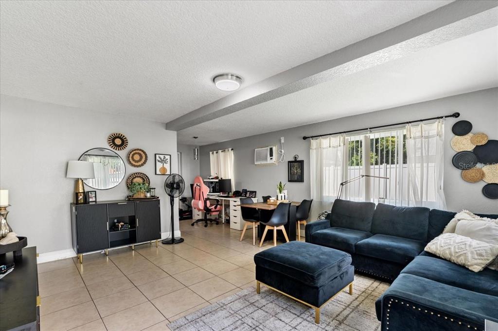 812 West Bryan Street Kissimmee, FL 34741 - Photo 8 of 27 a living room with furniture and a window