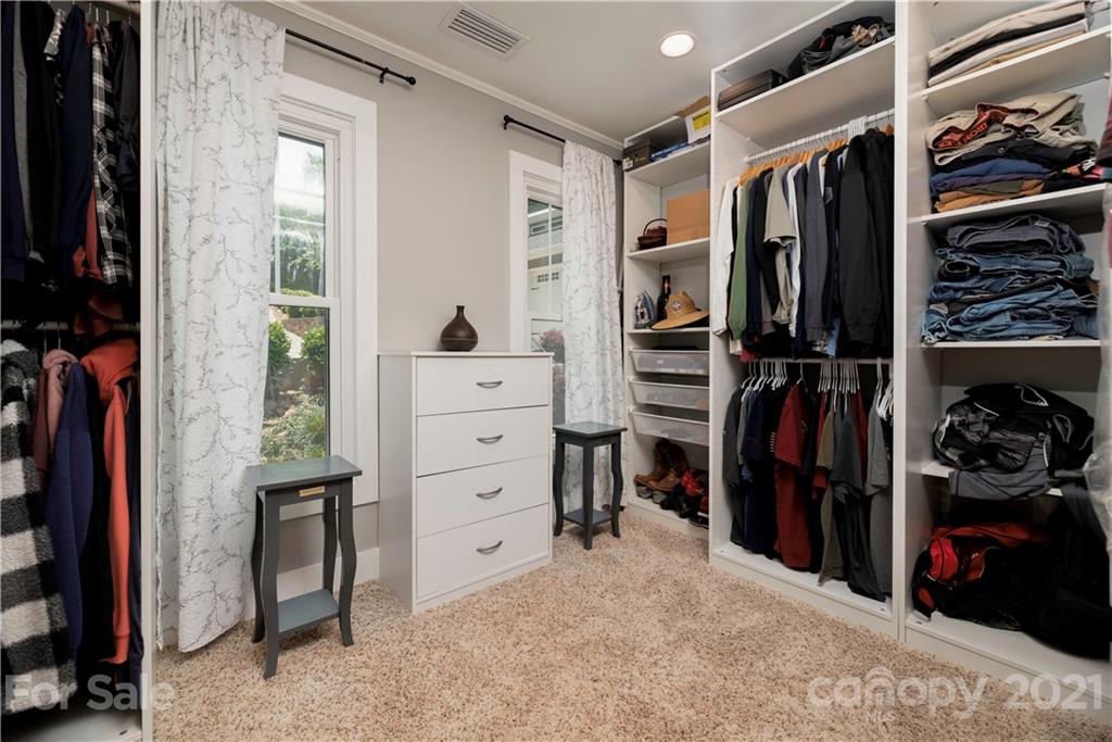 148 Lakeland Road Mooresville, NC 28117 - Photo 20 of 48 a view of walk in closet with clothes and shoes