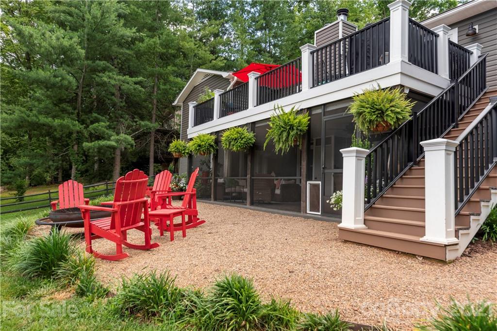 148 Lakeland Road Mooresville, NC 28117 - Photo 25 of 48 a backyard of a house with fire pit and outdoor seating