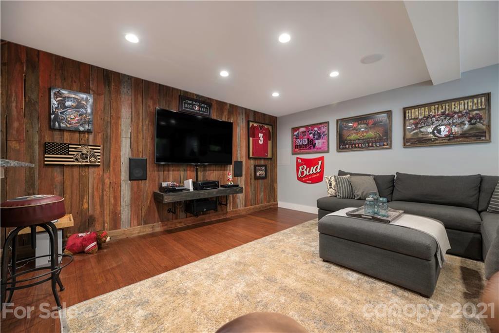 148 Lakeland Road Mooresville, NC 28117 - Photo 26 of 48 a living room with furniture and a flat screen tv