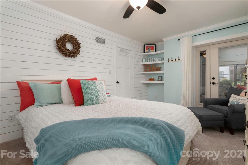 148 Lakeland Road Mooresville, NC 28117 - Photo 31 of 48 a bedroom with a bed and ceiling fan