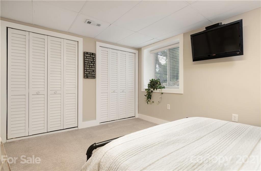 148 Lakeland Road Mooresville, NC 28117 - Photo 33 of 48 a bedroom with a bed and a flat screen tv