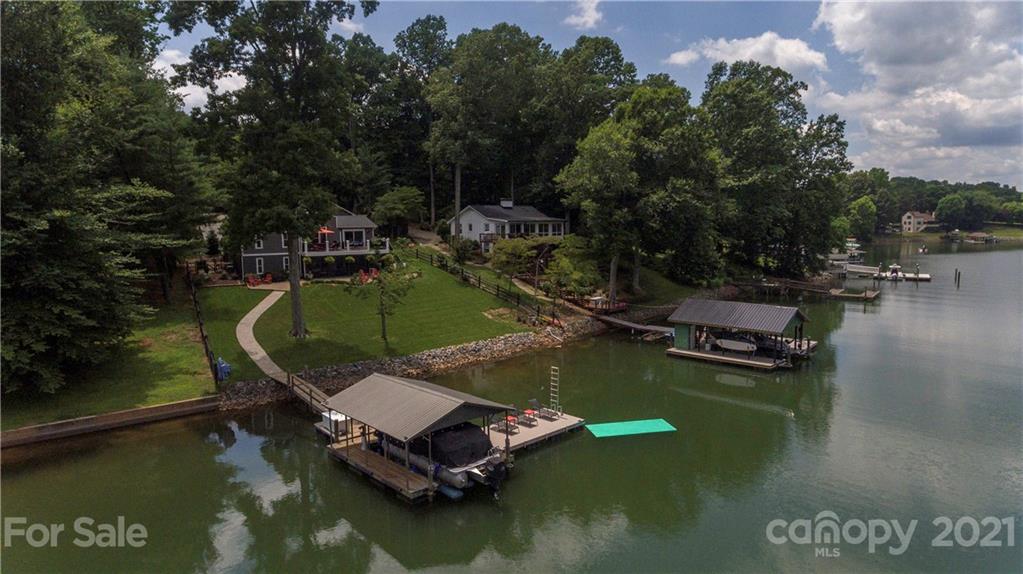 148 Lakeland Road Mooresville, NC 28117 - Photo 39 of 48 a view of a lake with chairs