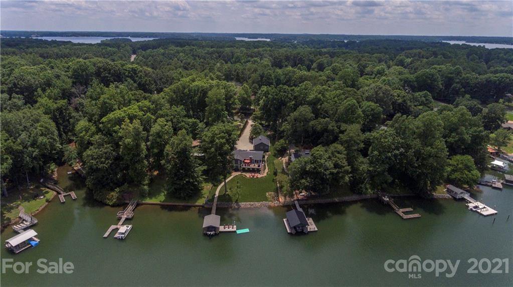 148 Lakeland Road Mooresville, NC 28117 - Photo 43 of 48 an aerial view of a house with a yard and lake view