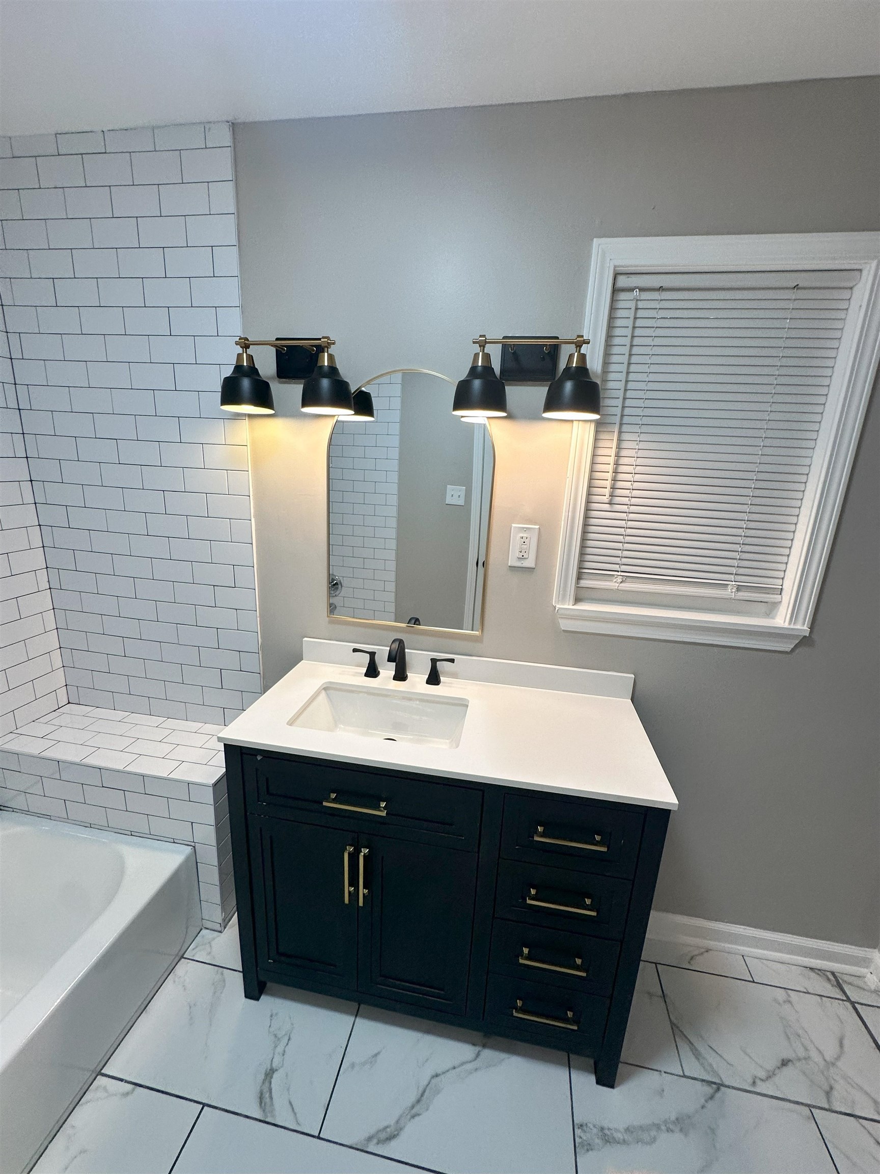 2820 Range Line Road Memphis, TN 38127 - Photo 24 of 35 a bathroom with a sink vanity and a mirror