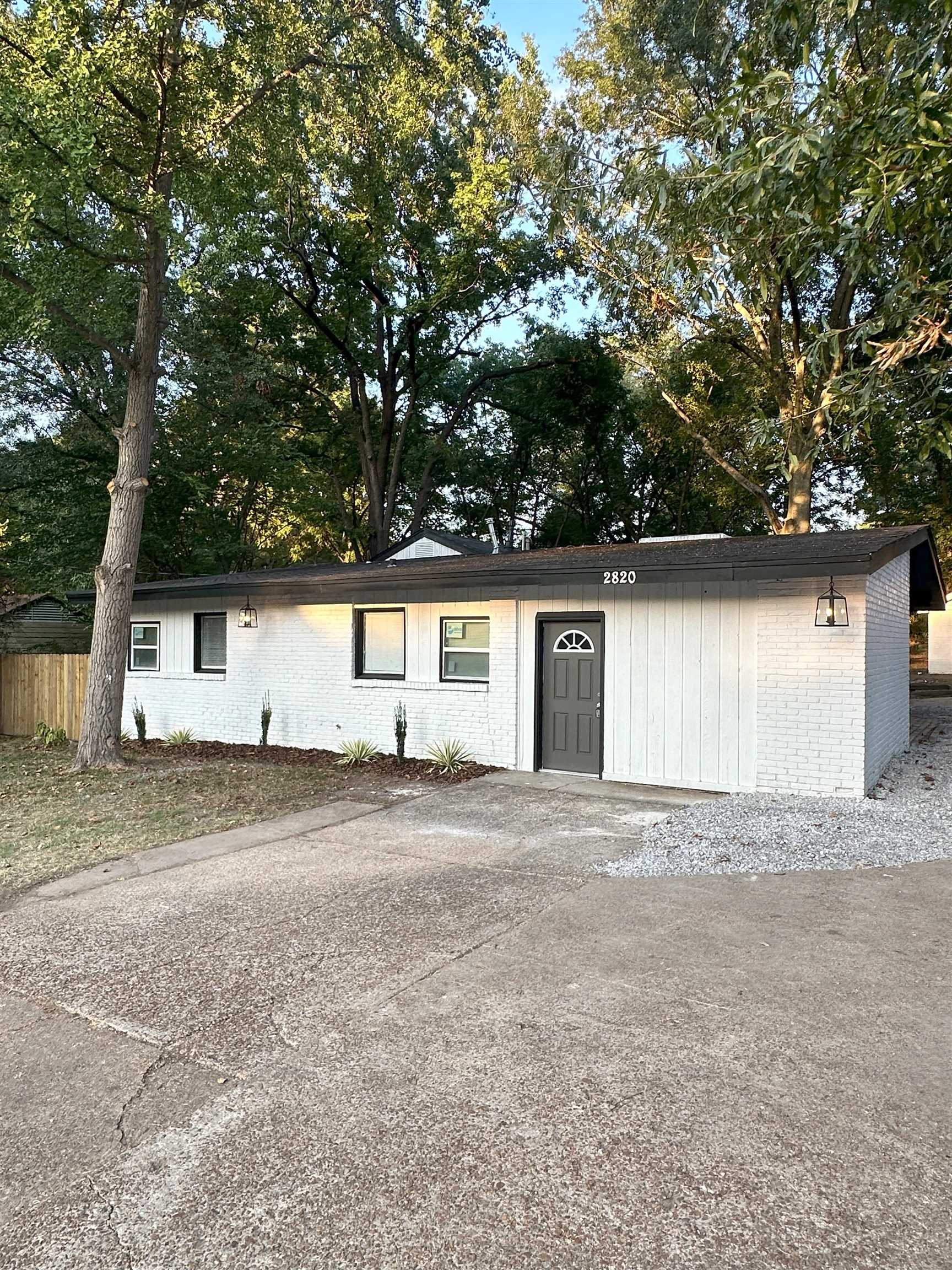 2820 Range Line Road Memphis, TN 38127 - Photo 4 of 35 a front view of a house with a yard and garage