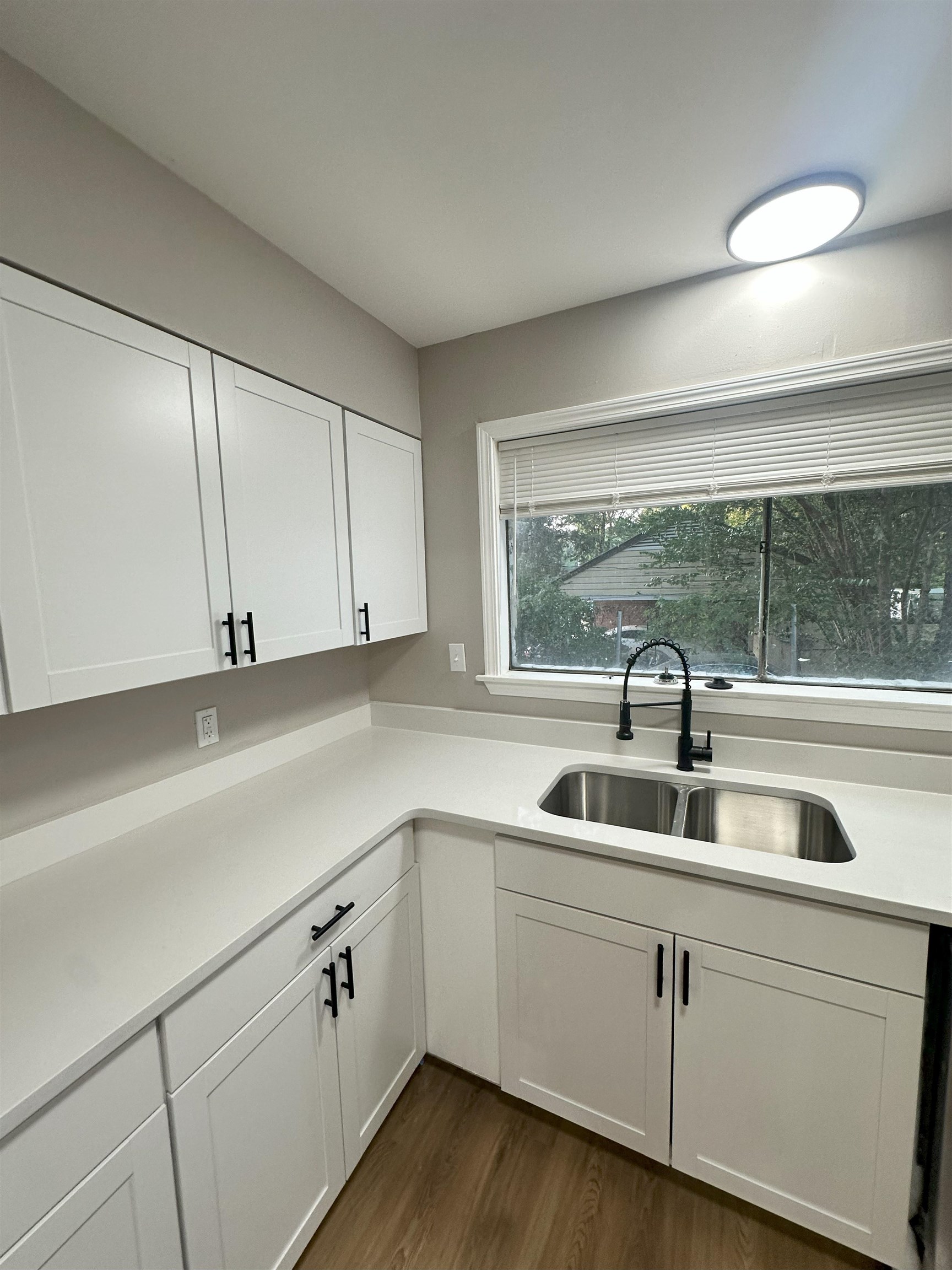 2820 Range Line Road Memphis, TN 38127 - Photo 8 of 35 a kitchen with a sink and cabinets