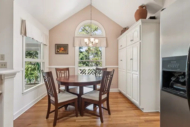 a view of a dining room with furniture window and wooden floor