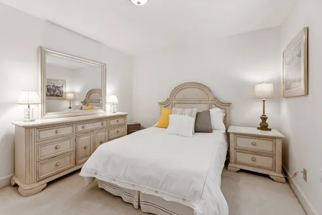 a bedroom with a bed and a dresser