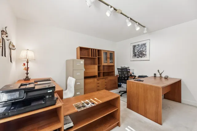 a view of a workspace with furniture