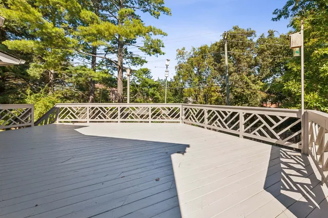 a street sign that is on a wooden floor