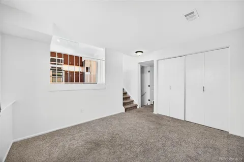 a view of an empty room with workspace