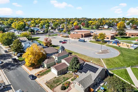 an aerial view of a house with yard swimming pool and outdoor seating