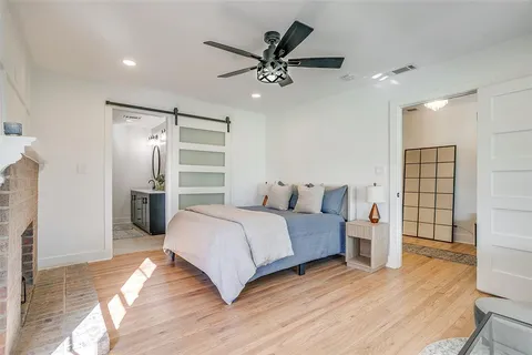 a bedroom with bed and window