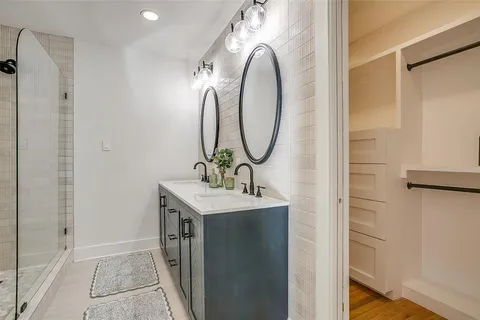 a bathroom with a sink and mirror