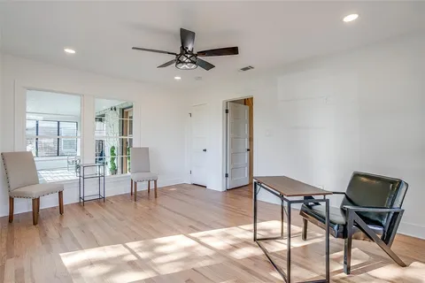 a bathroom with a granite countertop sink mirror and toilet