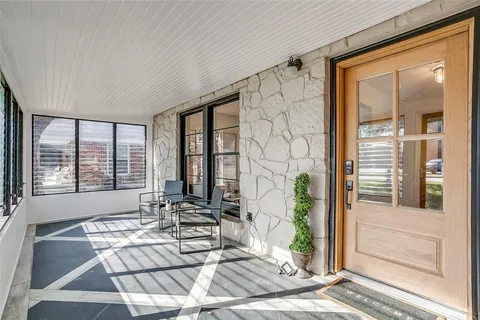 a living room with large windows