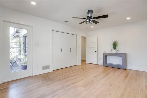 a bathroom with a granite countertop sink a toilet and shower
