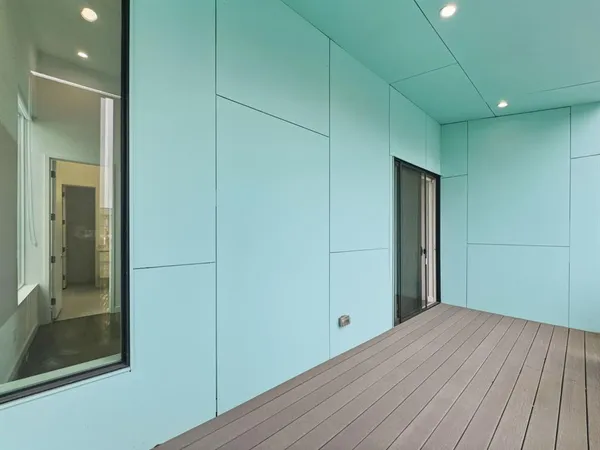 a view of hallway with wooden floor