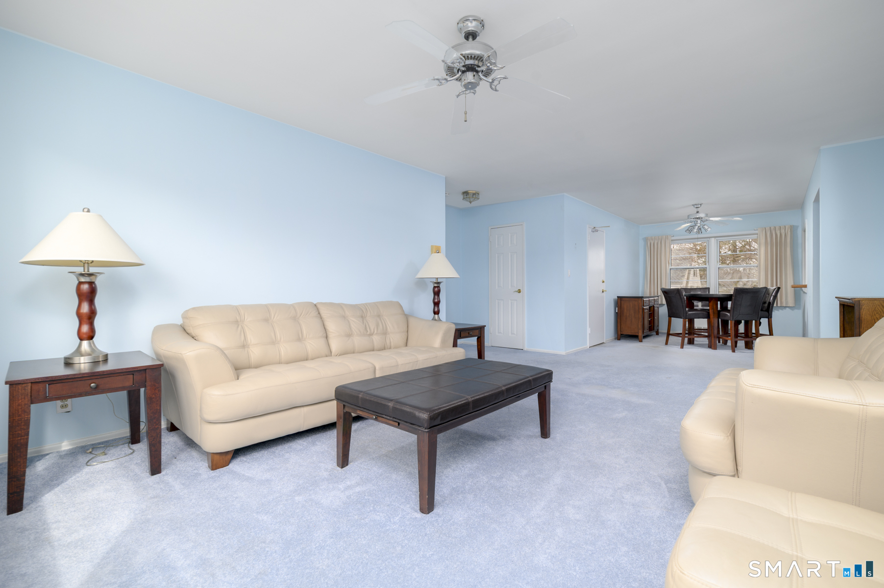 250 Glenbrook Road, Unit 38C Stamford, CT 06906 - Photo 6 of 23 Living room facing rear entry door from parking lot