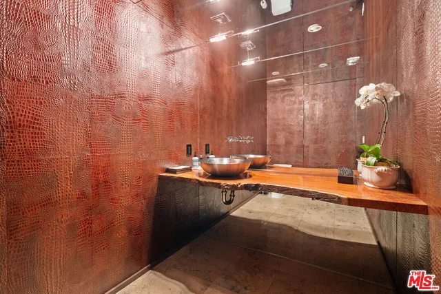 a bed sitting in a balcony next to a window