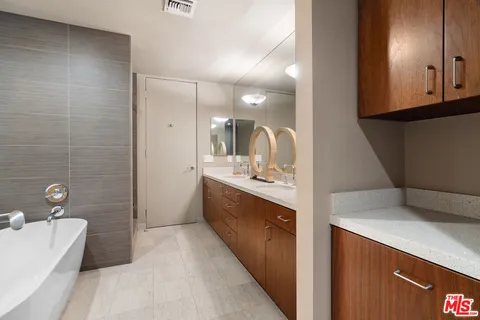 a backyard of a house with outdoor seating