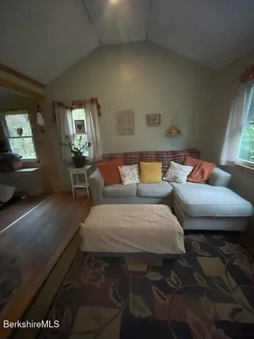 a bedroom with bed and window