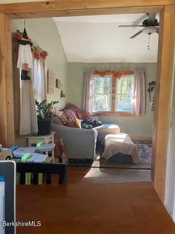 a bedroom with furniture and a window