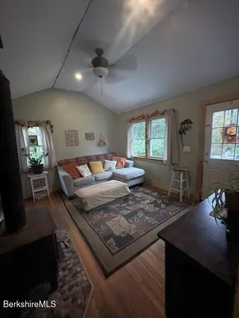 a bedroom with furniture and a lamp