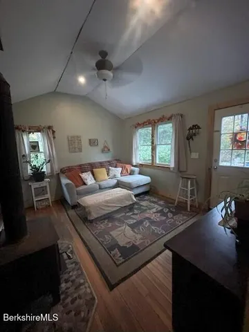 a bedroom with furniture and a lamp