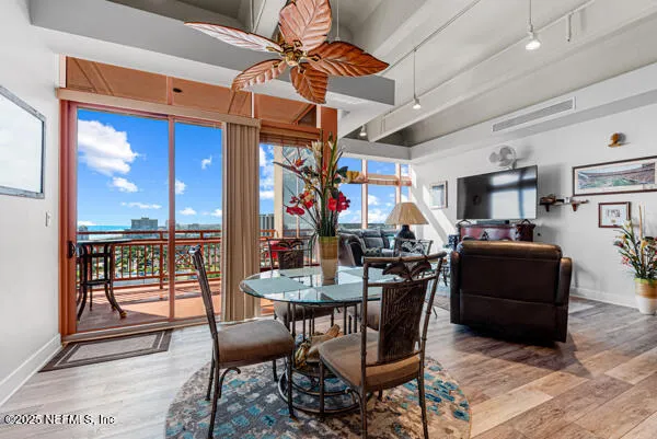 a view of a dining room with furniture window and outside view