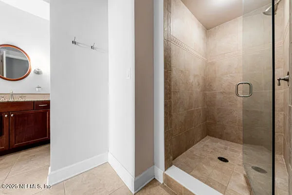a bathroom with a shower and a sink