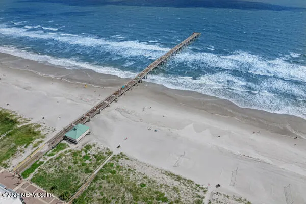a view of a dry yard with wooden fence