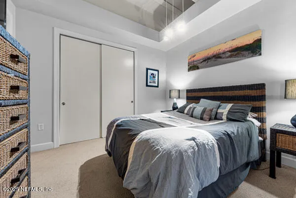 a bedroom with a bed and a walk in closet