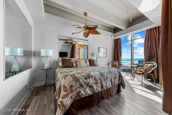 a bed room with a bed and a chandelier