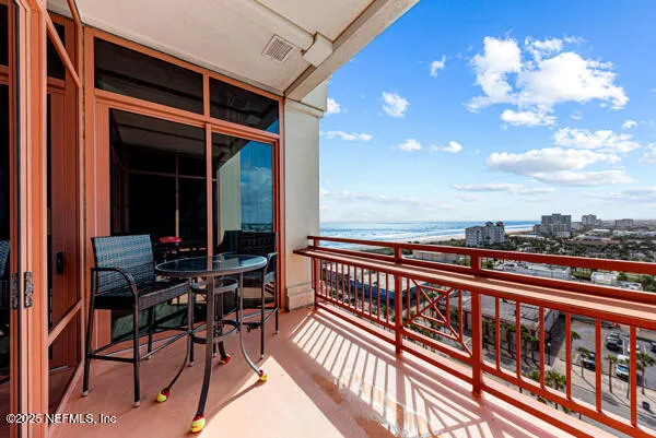 a view of a balcony with chairs