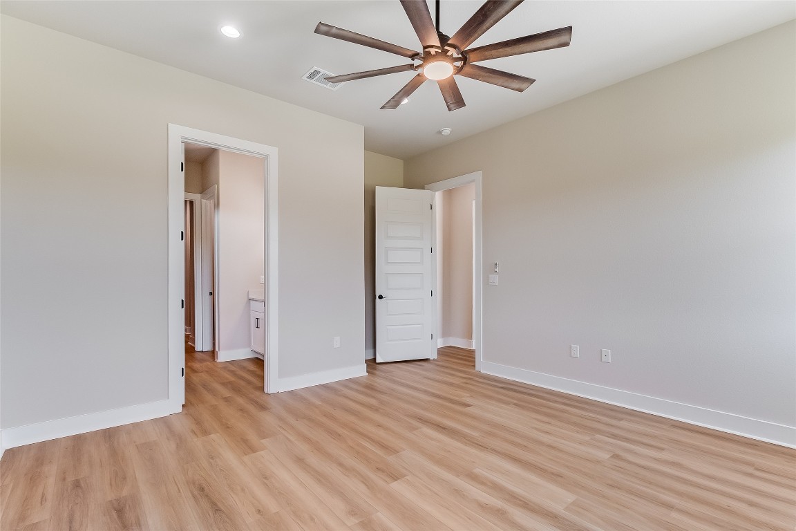 117 Rosebud Rnch Road Bertram, TX 78605 - Photo 15 of 29 an empty room with wooden floor and closet
