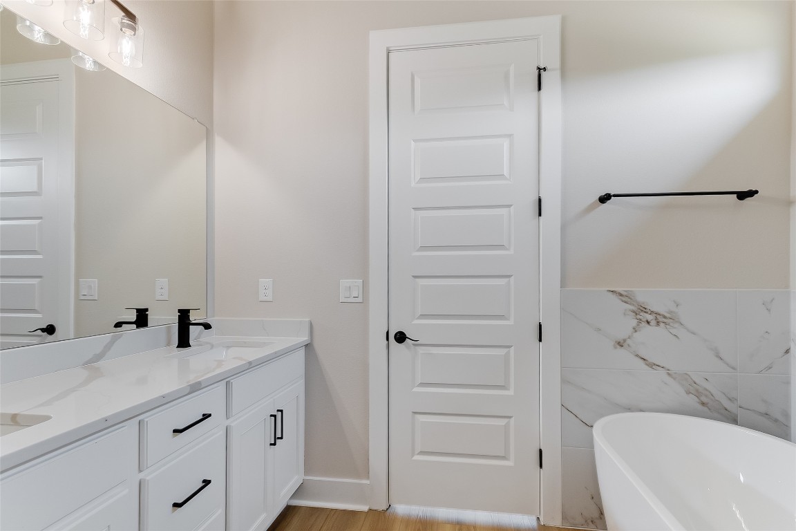 117 Rosebud Rnch Road Bertram, TX 78605 - Photo 17 of 29 a bathroom with a sink a toilet and shower