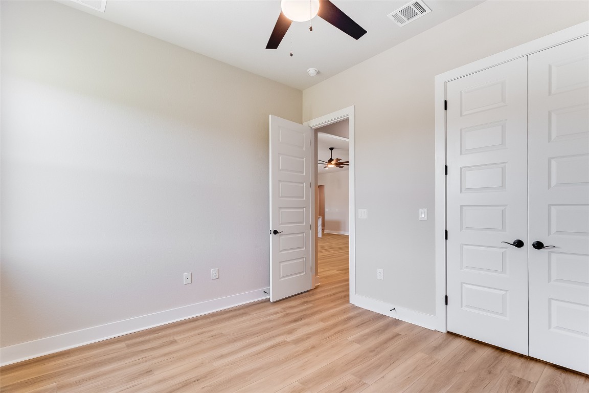 117 Rosebud Rnch Road Bertram, TX 78605 - Photo 23 of 29 wooden floor in an empty room