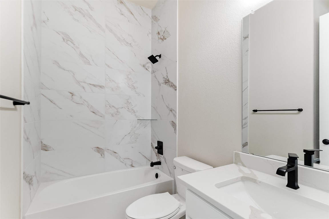 117 Rosebud Rnch Road Bertram, TX 78605 - Photo 24 of 29 a bathroom with a sink toilet and shower