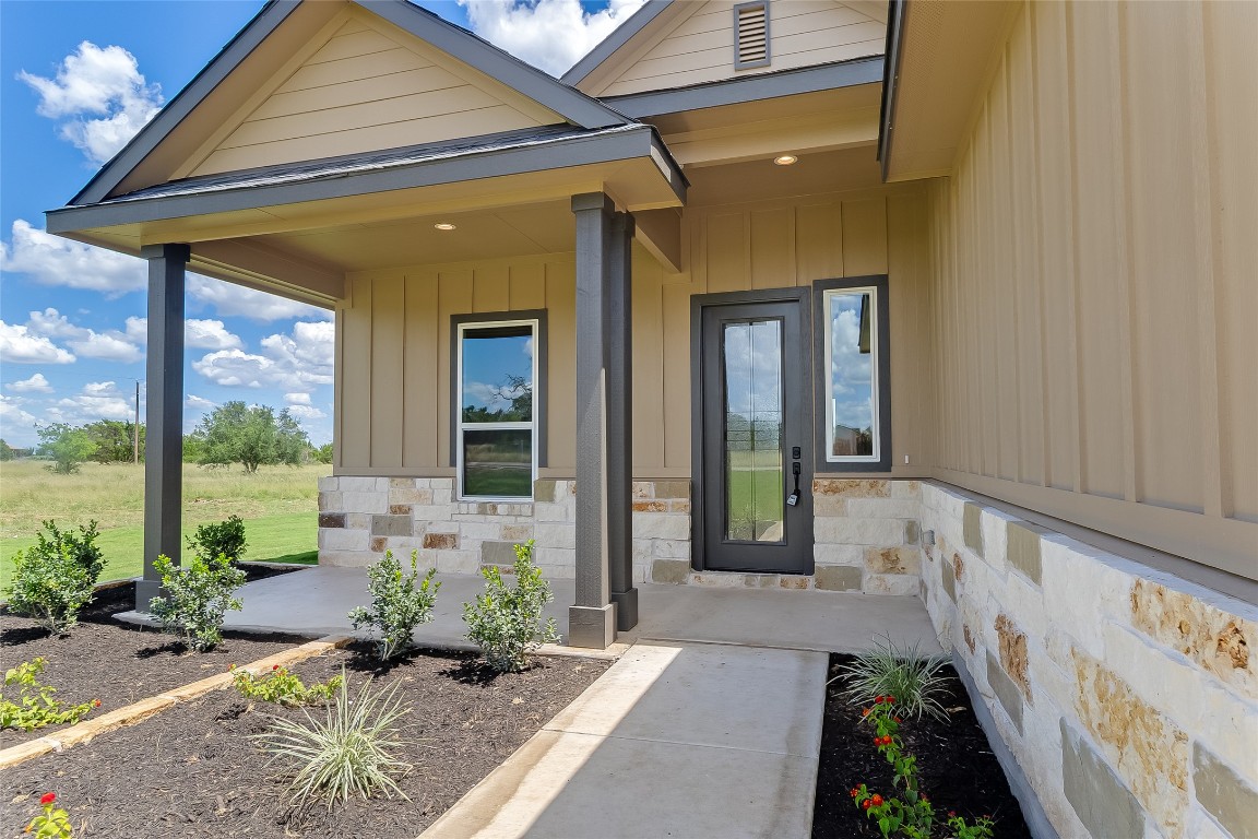 117 Rosebud Rnch Road Bertram, TX 78605 - Photo 3 of 29 a front view of a house with garden