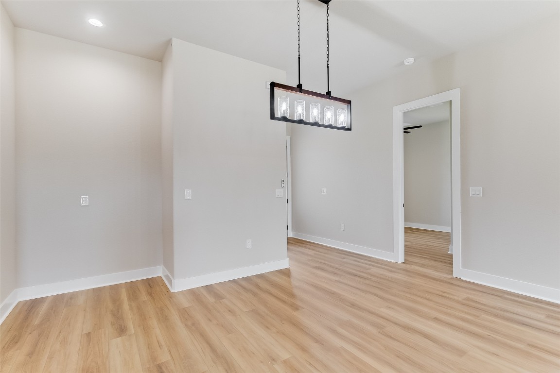 117 Rosebud Rnch Road Bertram, TX 78605 - Photo 9 of 29 a view of empty room with wooden floor