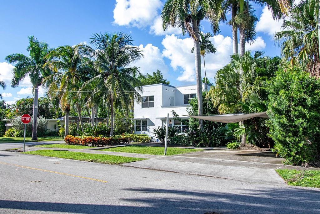 1255 Jackson Street Hollywood, FL 33019 - Photo 12 of 72 a view of a fountain in front of a house with a palm tree