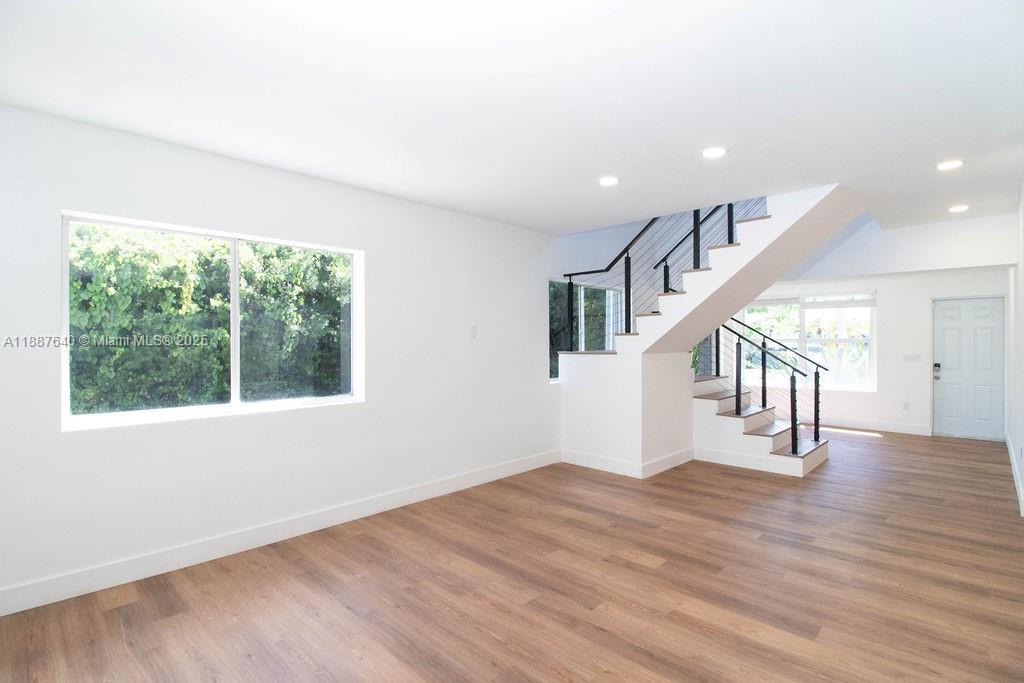 1255 Jackson Street Hollywood, FL 33019 - Photo 17 of 72 a view of empty room with wooden floor and fan