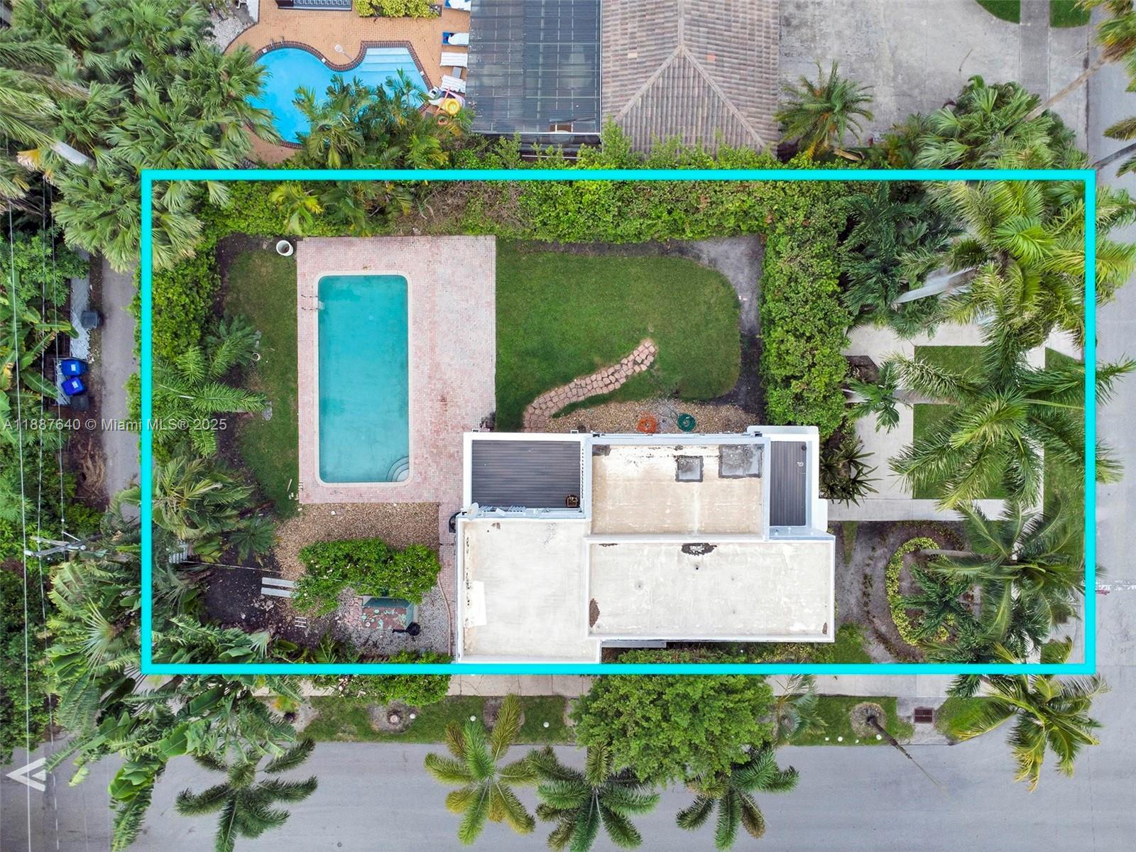 1255 Jackson Street Hollywood, FL 33019 - Photo 2 of 72 an aerial view of a house with a garden and a yard