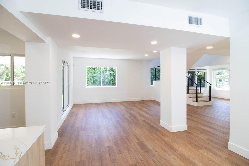 1255 Jackson Street Hollywood, FL 33019 - Photo 21 of 72 a view of a hallway with wooden floor windows and a living room