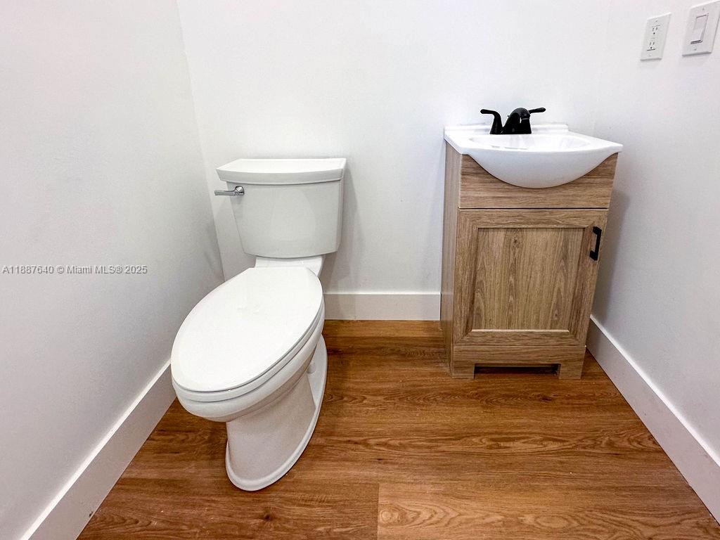 1255 Jackson Street Hollywood, FL 33019 - Photo 36 of 72 a bathroom with a sink and a toilet