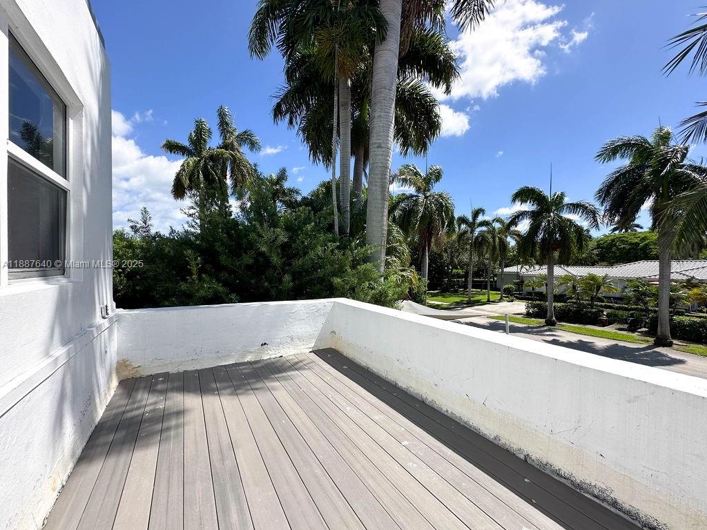 1255 Jackson Street Hollywood, FL 33019 - Photo 40 of 72 a view of a balcony with trees