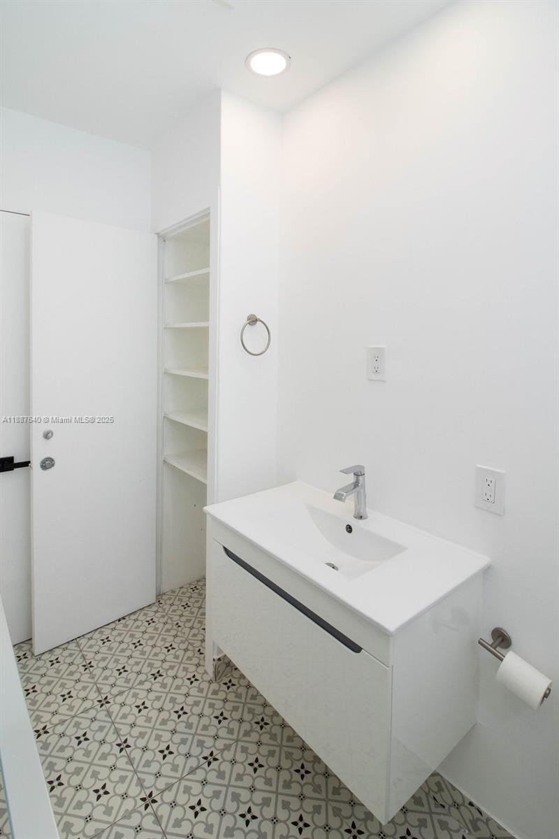 1255 Jackson Street Hollywood, FL 33019 - Photo 46 of 72 a bathroom with a sink toilet and shower